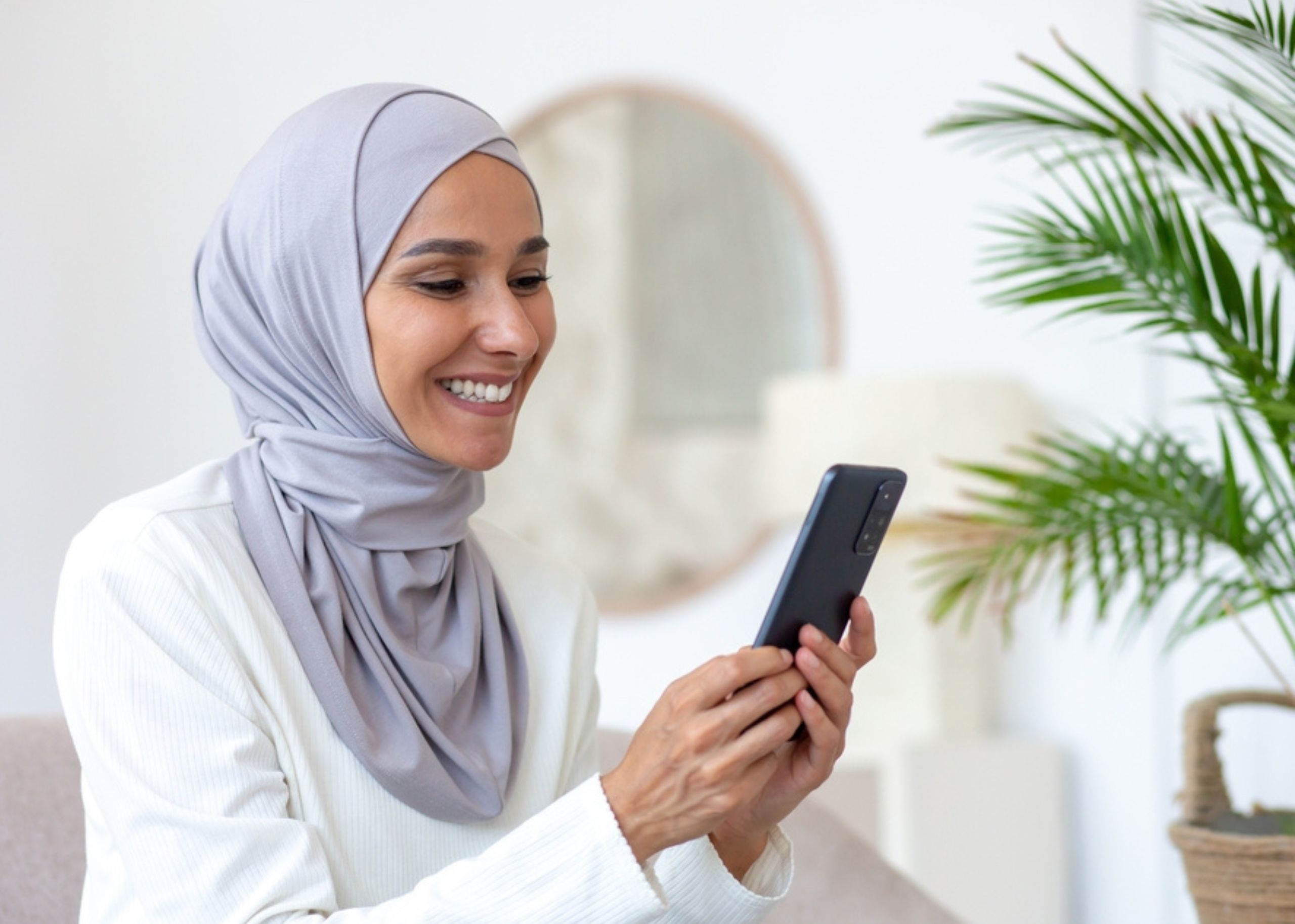 muslim woman with mobile phone